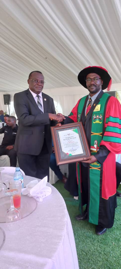 Prof. Masembe receiving his Research Excellence Award from the Chief Justice. Congratulation to Prof. Charles Masembe. #Mak74thGrad