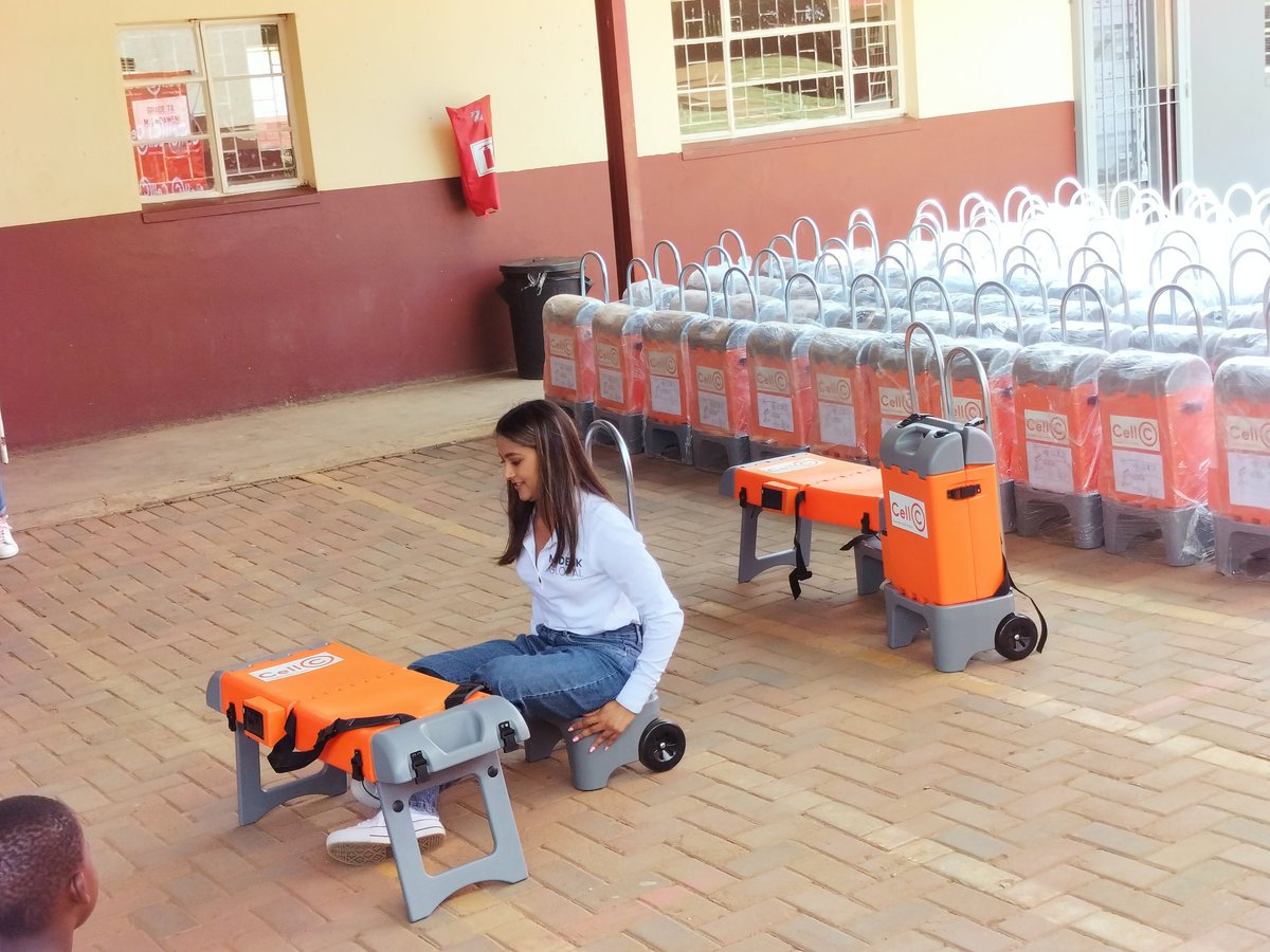 SedibengDM's tweet photo. Talita Boodhram the inventor of MiDesk demonstrating how it works. MiDesk is a versatile school bag that can store books, has a solar-powered light, can be used as a wheelie bag, and even works as a chair. https://t.co/4WGtpwrTV0