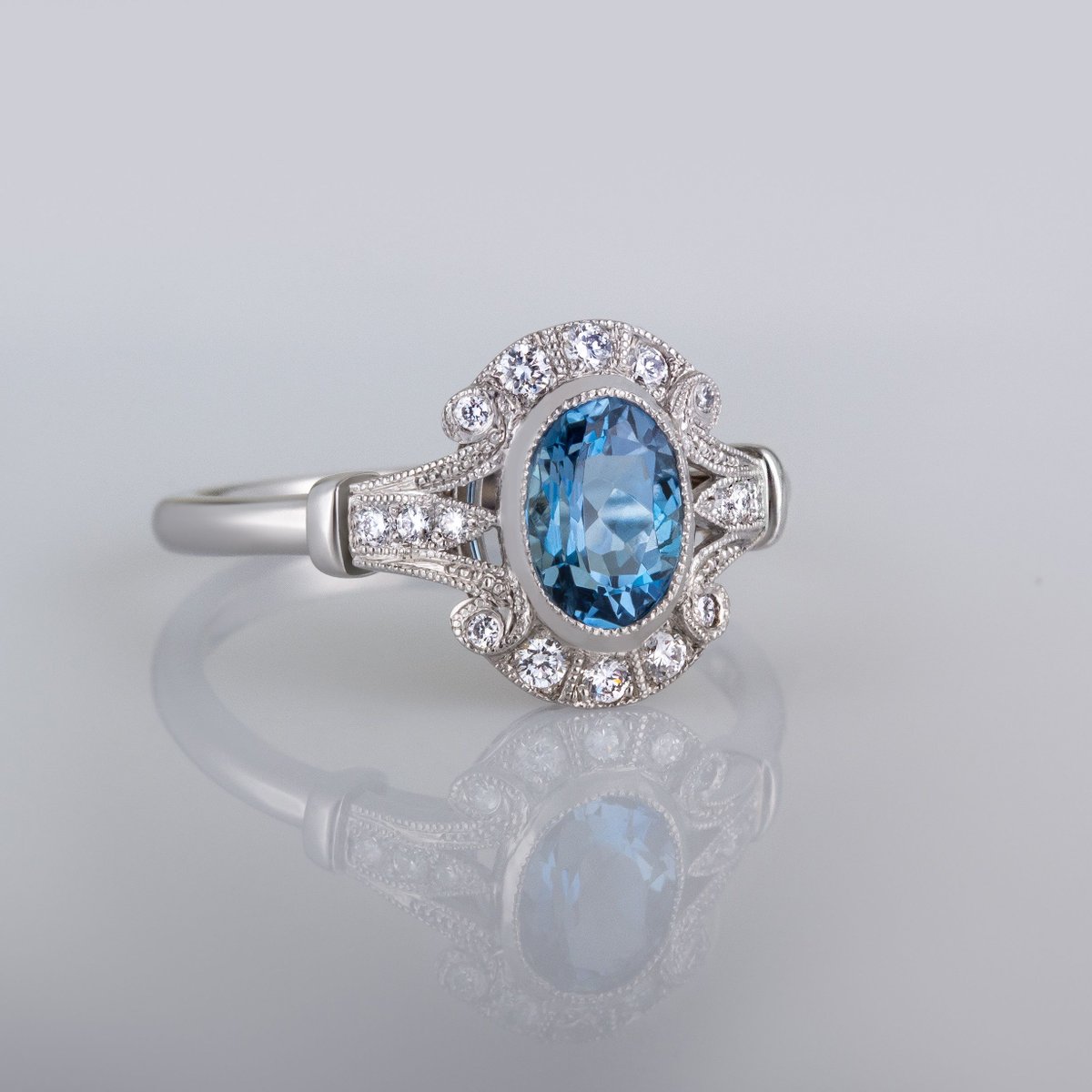 This vintage style aquamarine and diamond cluster ring design in platinum is set with an outstanding quality Santa Maria aquamarine. 

 #aquamarine  #platinumring #vintagerings #vintagestylerings 
#aquamarine #jewellery #engagementring 

Ring Model: 9065