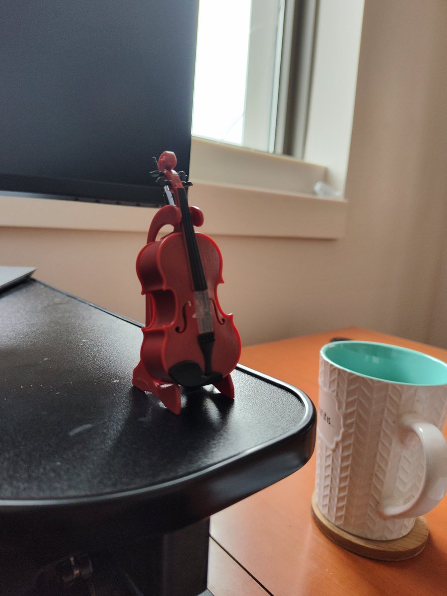 bmomeni's tweet photo. It's so nice to have a supportive partner in life. My dear wife got me a tiny violin (maybe not the world's smallest, but close) to play a song of melancholy when another rejection comes in. #LifeInAcademia #blessed https://t.co/ucNfPkLCrq