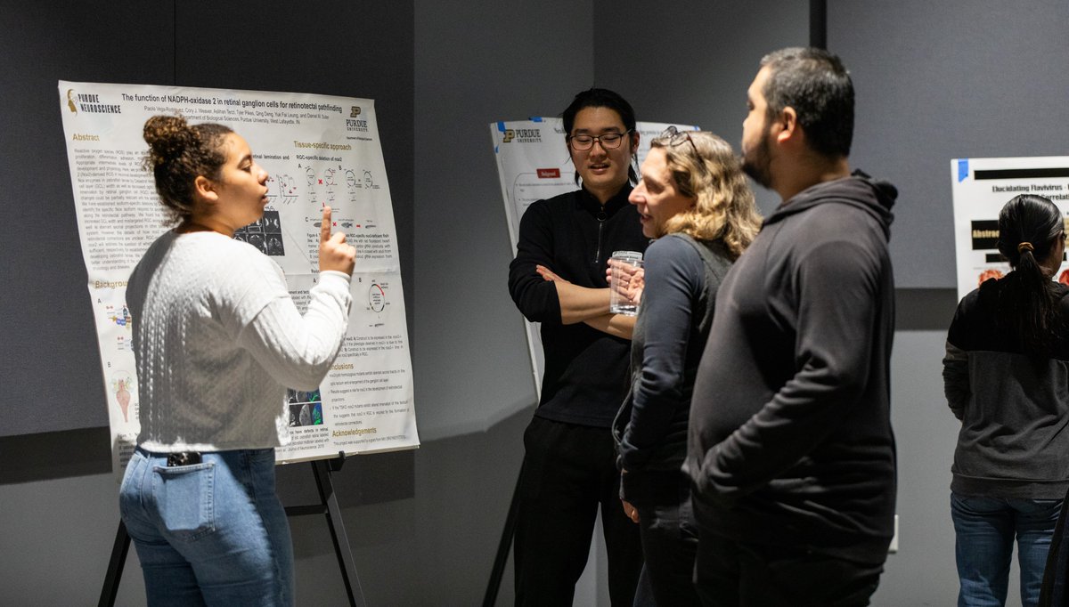 PurdueSuterLab's tweet photo. Laura presents a talk, Paola presents a poster, and Seema and Daniel show strengths with one arm at the Biological Sciences retreat. https://t.co/llPPEseW9J