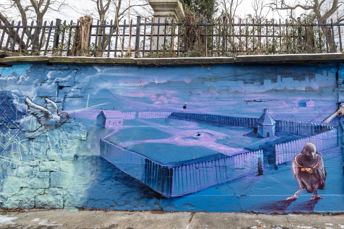 This city-block-long mural at 80 Tuers Ave by Jersey City artist DISTORT was completed late in 2023 as part of the #JerseyCity Mural Arts Program. The beautiful imagery depicts historic landmarks: Bergen Church & Cemetery & the original boundaries of Bergen Square.

#MuralMonday