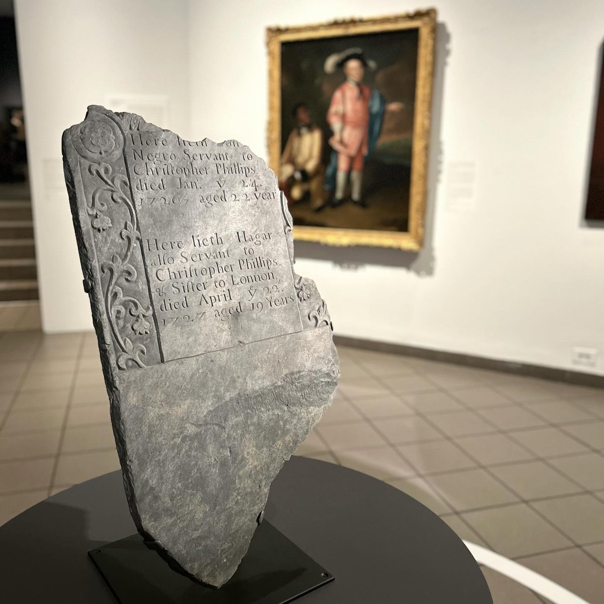 Slate gravestone fragment, carved for siblings Lonnon (circa 1704-1726) and Hagar (circa 1708-1727), enslaved by Christopher Phillips (1693-1753) of North Kingtown, Rhode Island. The fragment is now owned by the South County History Center.

#VastEarlyAmerica
#SlaveryArchive