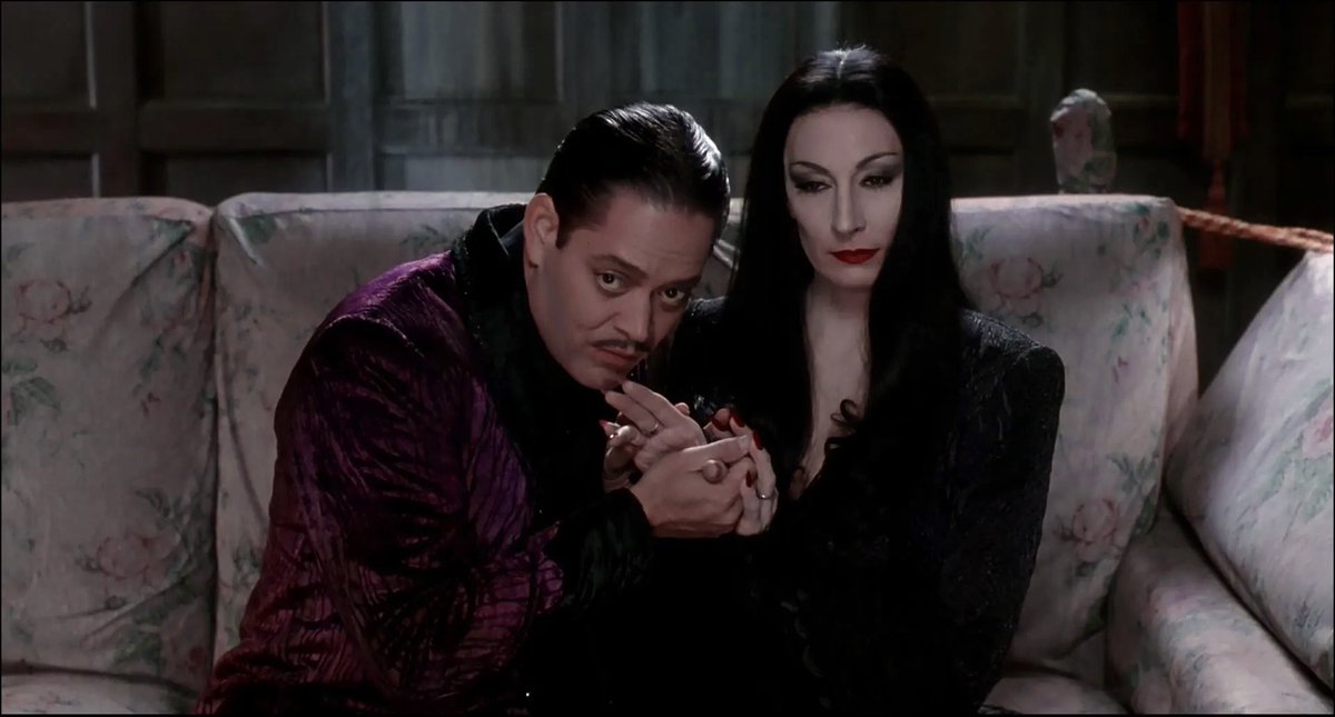 horrorlogy's tweet photo. morticia and gomez judging you https://t.co/FMdlxvyNG5