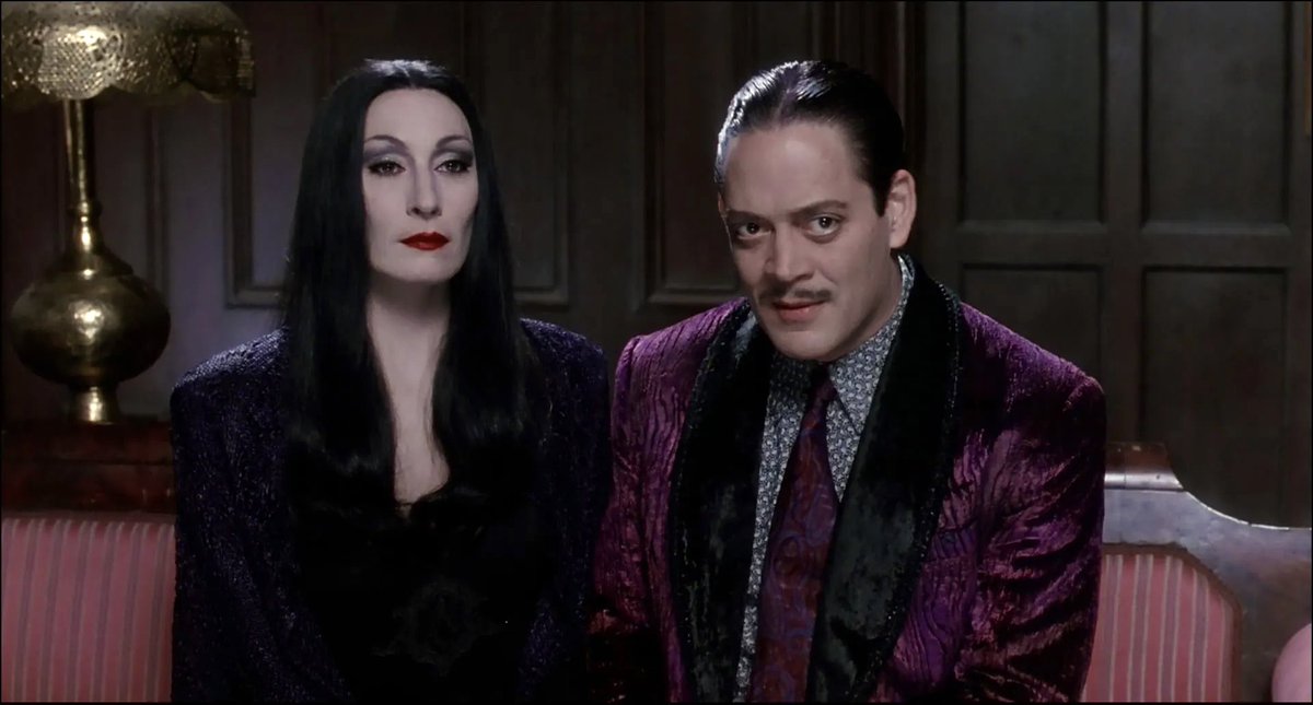 horrorlogy's tweet photo. morticia and gomez judging you https://t.co/FMdlxvyNG5