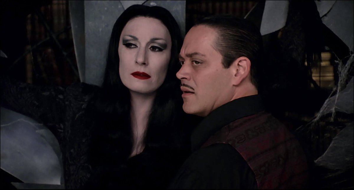 horrorlogy's tweet photo. morticia and gomez judging you https://t.co/FMdlxvyNG5
