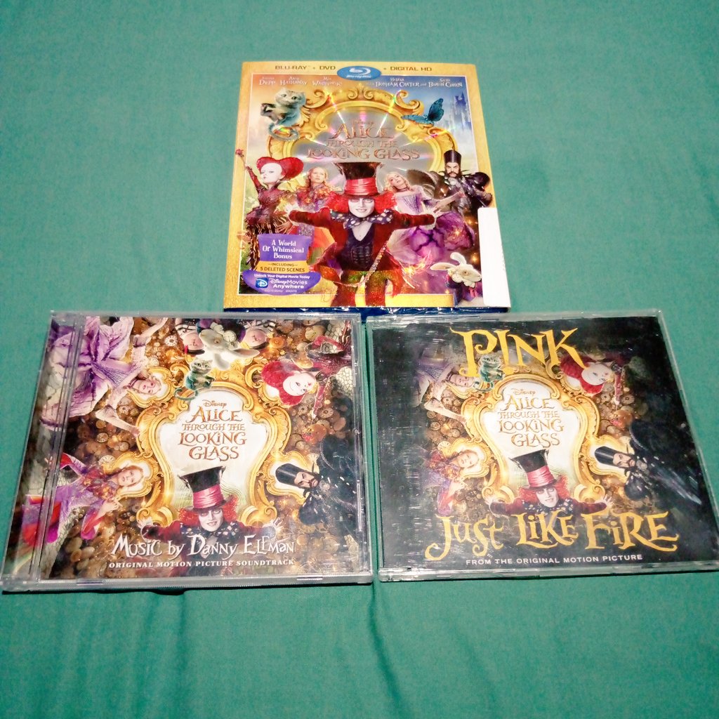 charsachz's tweet photo. More than my collection, this time Alice Through the Looking Glass DVD/Blu-Ray, OST and @Pink CD Single #JustLikeFire https://t.co/4K5LTBKEwL