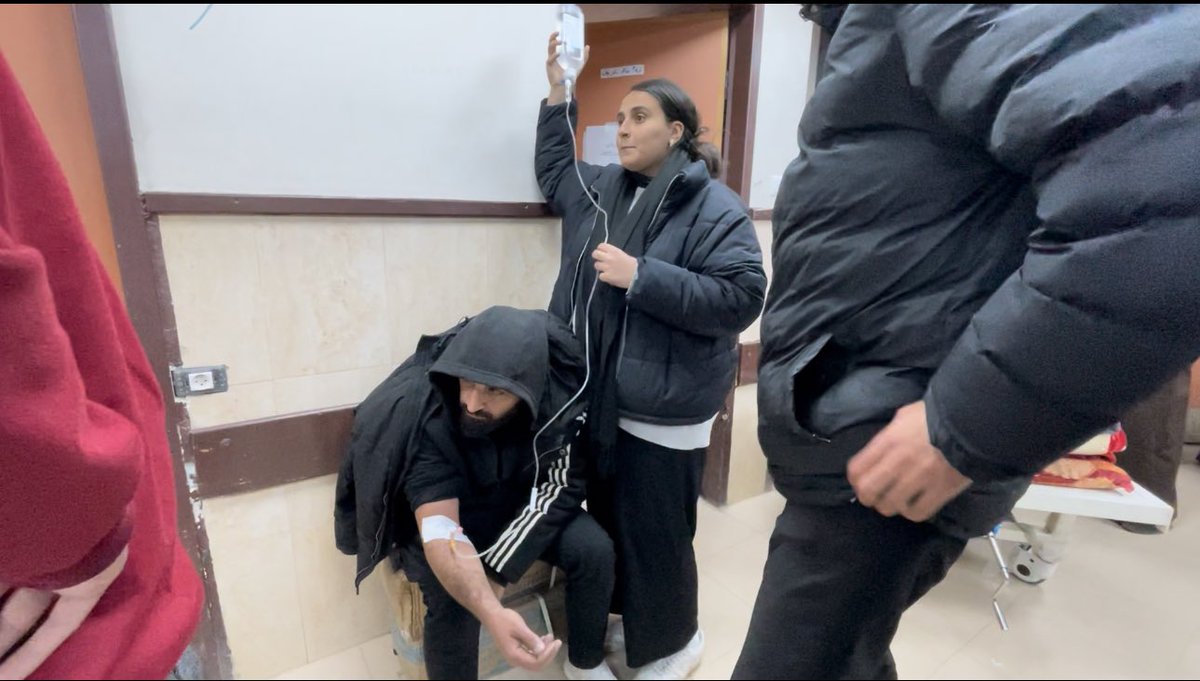 Yesterday <a href="/alijadallah66/">Ali Jadallah 𓂆</a> was exhausted we took him to the emergency department.
First, there was no bed for him - the hospital was packed.
He sat on boxes of bandages.
There was no solution holders so I held it for him.
There were no doctors so volunteer nurses helped him.