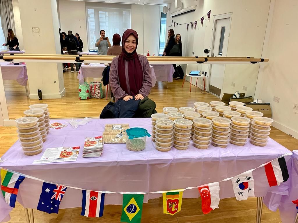 DialogueSociety's tweet photo. Tugba, our star volunteer, brought Noah's Pudding to @kclsu's One World Festival! Experience rich array of events from 20 Jan - 2 Feb at @KingsCollegeLon. Celebrate the beauty of diversity with us! #PeanceAndUnity https://t.co/UFrJLM19fz