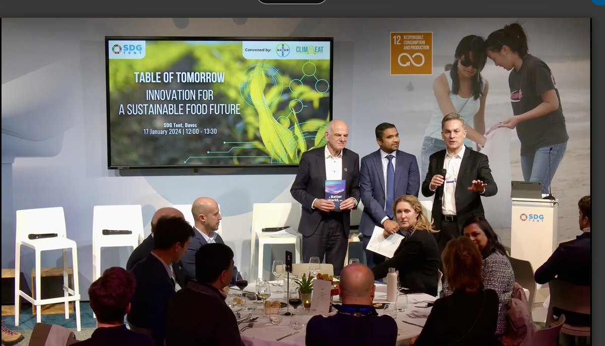 Although I did not make it to #Davos, my new book did! Presented by ⁦@GabrielaBurian⁩ ⁦@Bayer⁩ to ⁦@davidnabarro⁩ & Rodrigo Santos pictured here w Dhanush Dinesh ⁦@Clim_Eat⁩ at the “Table of Tomorrow: Innovation for a Sustainable Food Future” 📘🌐🙏