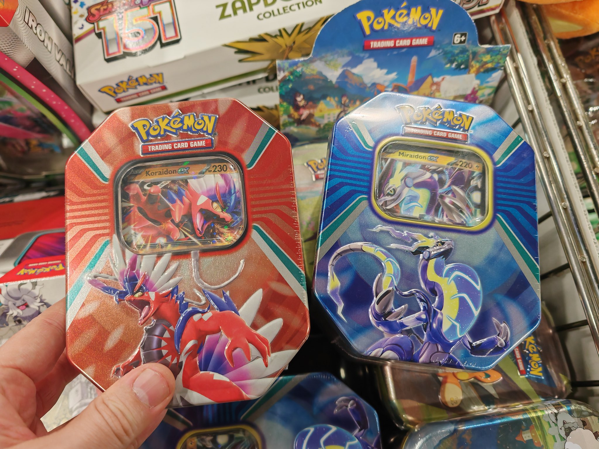 Pokemon Cards - REAL Pokemon Tin VS FAKE Pokemon TIn!! 