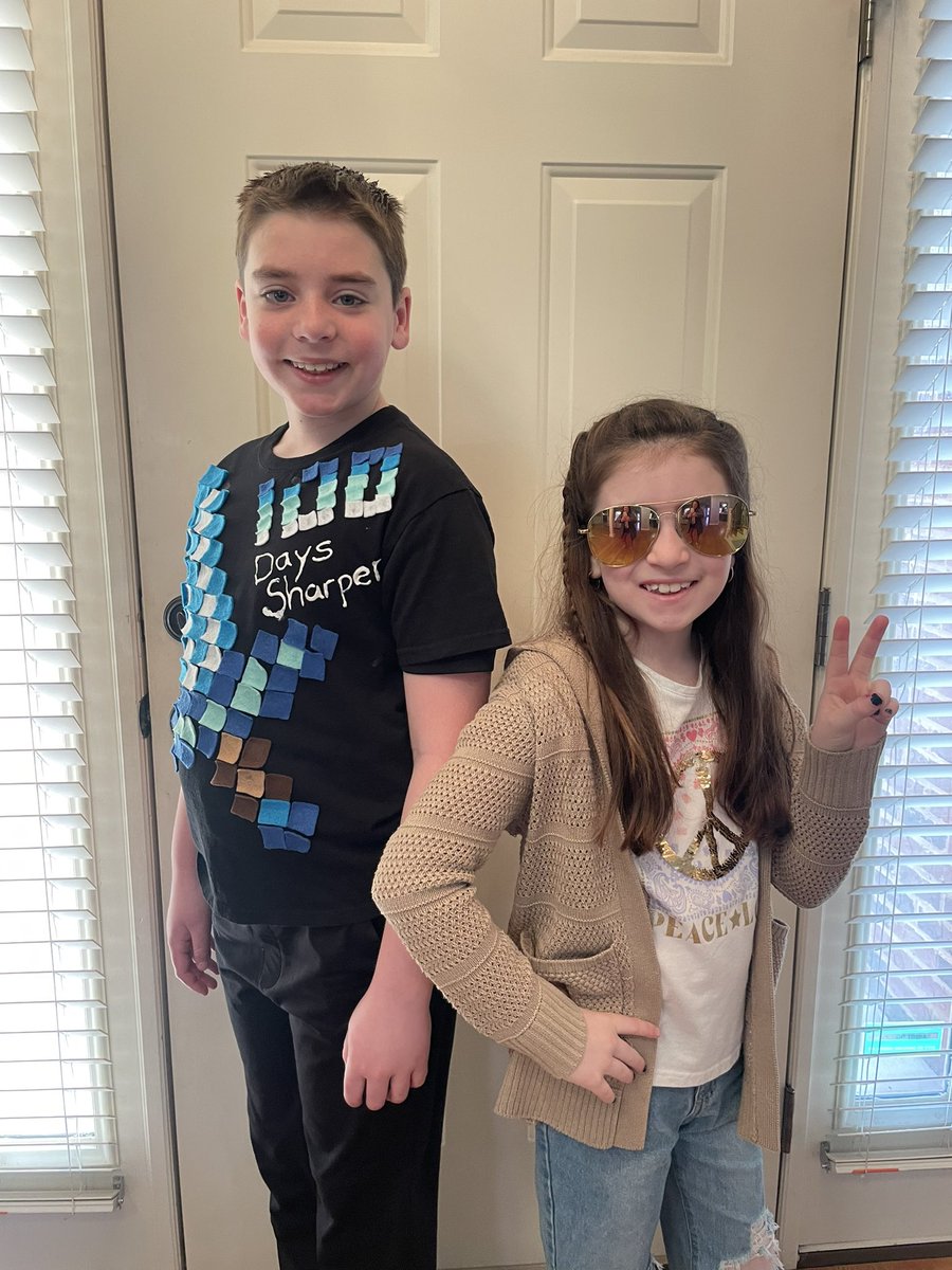 mszimmercte's tweet photo. 100th Day of School and 70’s Day, (70 days left of school)! When Ryan had to make this shirt in first grade, I got it a size big so he could use it for two years. He’s such a good sport, he’s wearing it for the 5th year in a row🤣 @BriarwoodES https://t.co/srgJFl6a38
