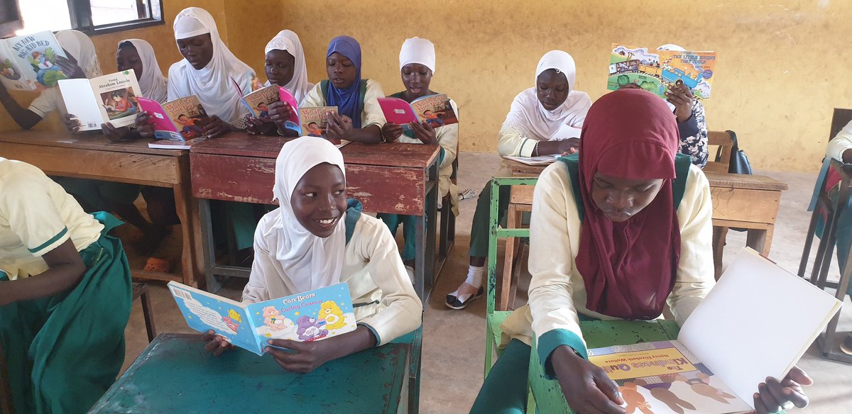 Look at these happy faces! These kids are enjoying their books from our little libraries, which provide access to books and educational resources in underserved communities.
