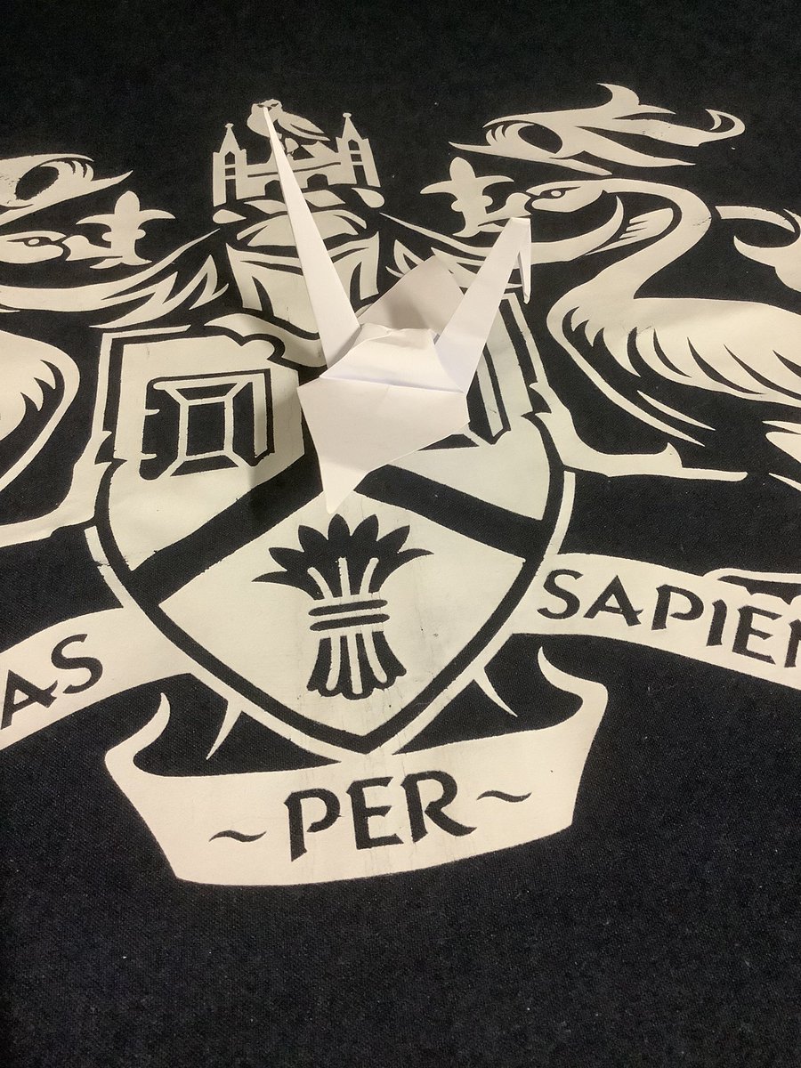 A little origami swan in the <a href="/LibraryUoL/">The libraries of the University of Lincoln</a> swimming on <a href="/unilincoln/">University of Lincoln, UK</a> lake.