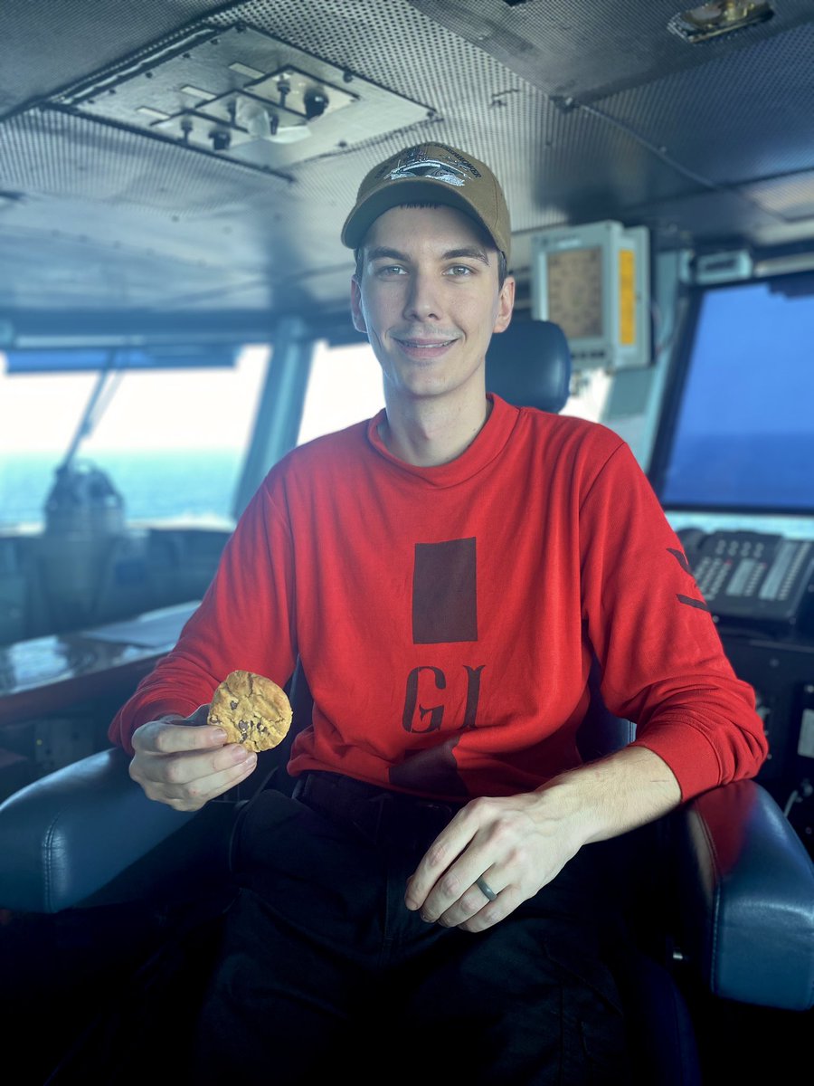 ChowdahHill's tweet photo. Unsuspecting Petty Officer called to the bridge after doing maintenance on bomb trailers. Given the Captain’s chair + cookie.

Me: Your mom, dad and brother miss you.

Him to family: Doing great out here and getting the job done!

(He is in fact crushing it!) https://t.co/2RyPECeaQE