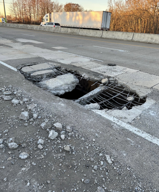 BIGGEST and DEEPEST pothole I have ever seen! I'm told this is on I-440 between exit 9 and exit 10 northbound. A 15 passenger van hit it this Tuesday morning and it's a total loss. No injuries! BE CAREFUL!