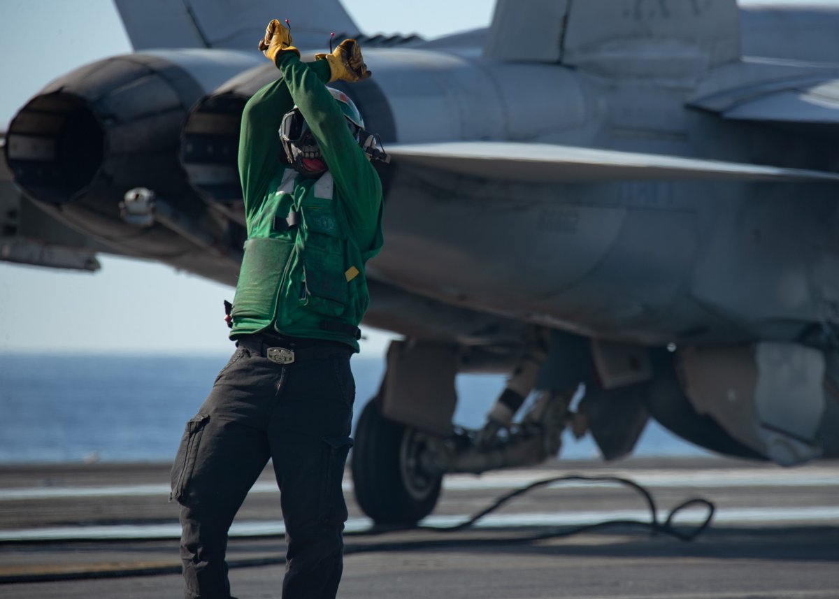 Meet Petty Officer 2nd Class William Black, the maestro on the flight deck of <a href="/Warship_78/">MEGA GAMING CLUB</a>. 

Directing F/A-18E Super Hornet for routine ops in the Mediterranean Sea.