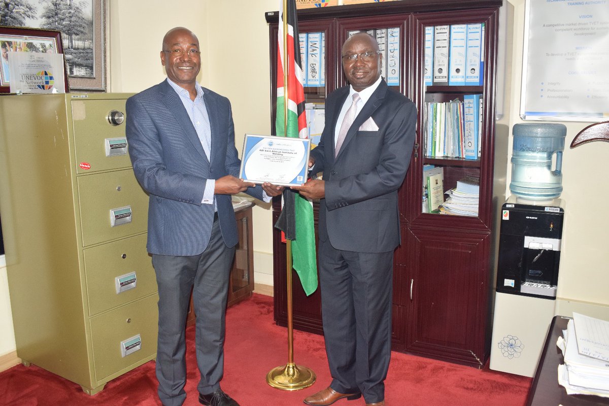 East African Institute Director Mr Lyoba showing  <a href="/Langat_Kipkirui/">Langat Kipkirui, MBS, Director General TVETA Kenya</a> DG of TVETA Canadian Welding Bureau (CWB) Plaque attesting the Institute as CWB Testing Center.