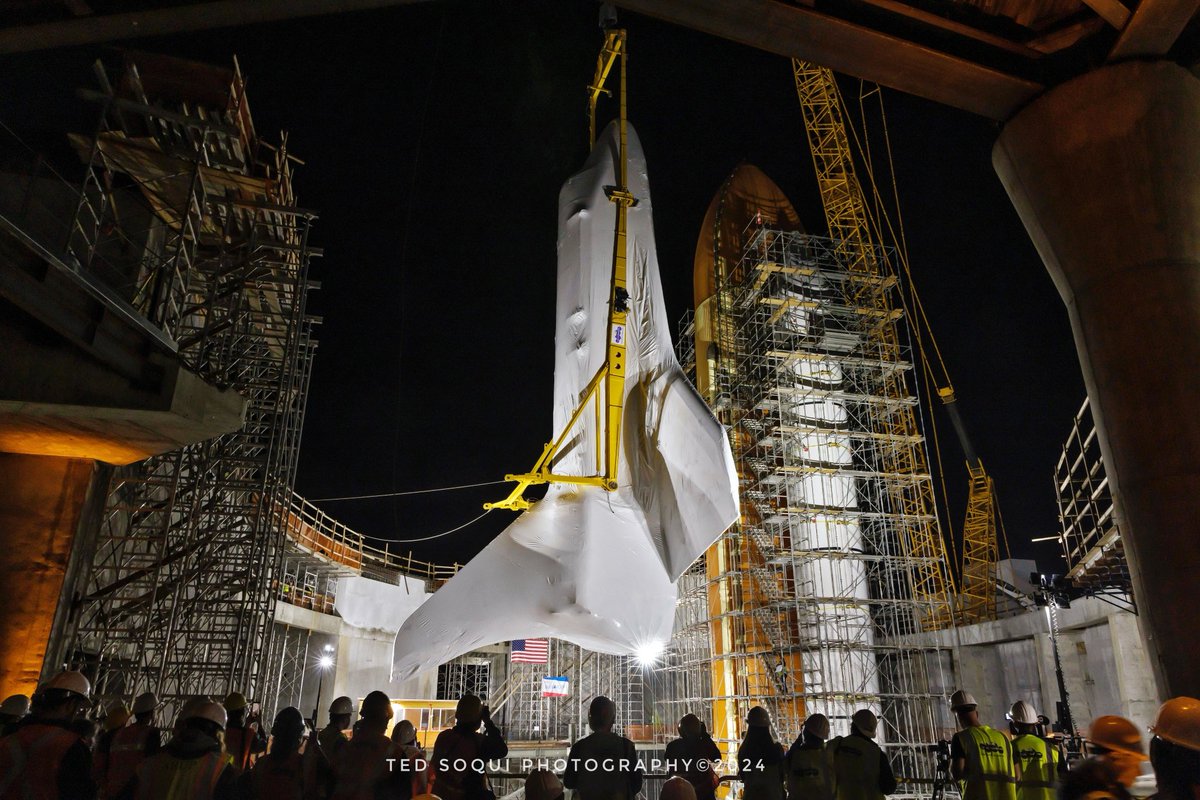 The Space Shuttle Endeavour being lowered in to launch position at the California Science Center in LA. The shuttle, rockets, and booster will be the center piece of a 20 story indoor exhibit at the center. #space #nasa #spaceshuttleendeavour