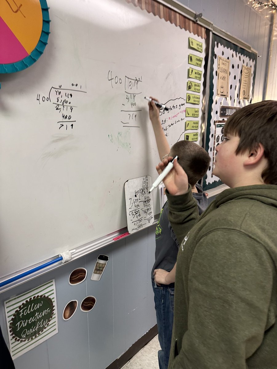 ChristineGindle's tweet photo. Sometimes my kids struggle after recess or get their minds focused. Today we used our vertical whiteboards with our partner to find out how 10,119 ft of the largest noodle could be shared among 400 people. @IllustrateMath https://t.co/4P617BNQzr