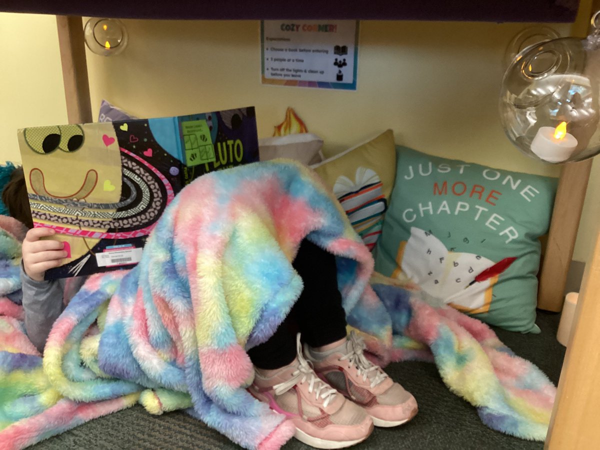 dancelibrarian's tweet photo. A 2nd grader found a book recommended by a #ReaderLeader and spent the rest of class reading it in the Cozy Corner (created by last year’s Reader Leaders). These post-its are definitely working! https://t.co/oFsTcFV2RJ