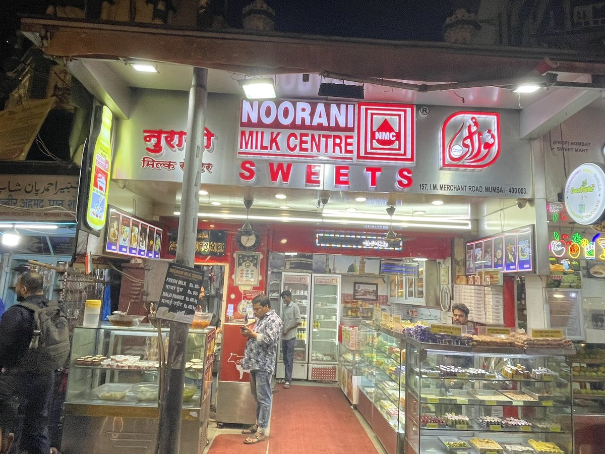 Jilani Noorani of the Noorani milk centre at Mohammad Ali road tells me that his father and uncle were arrested post the 92 Babri demolition. Born in 1993, a child of the Mumbai riots, he witnessed a JCB bulldozer pull down the awning of his shop a day after the Mira Road attack