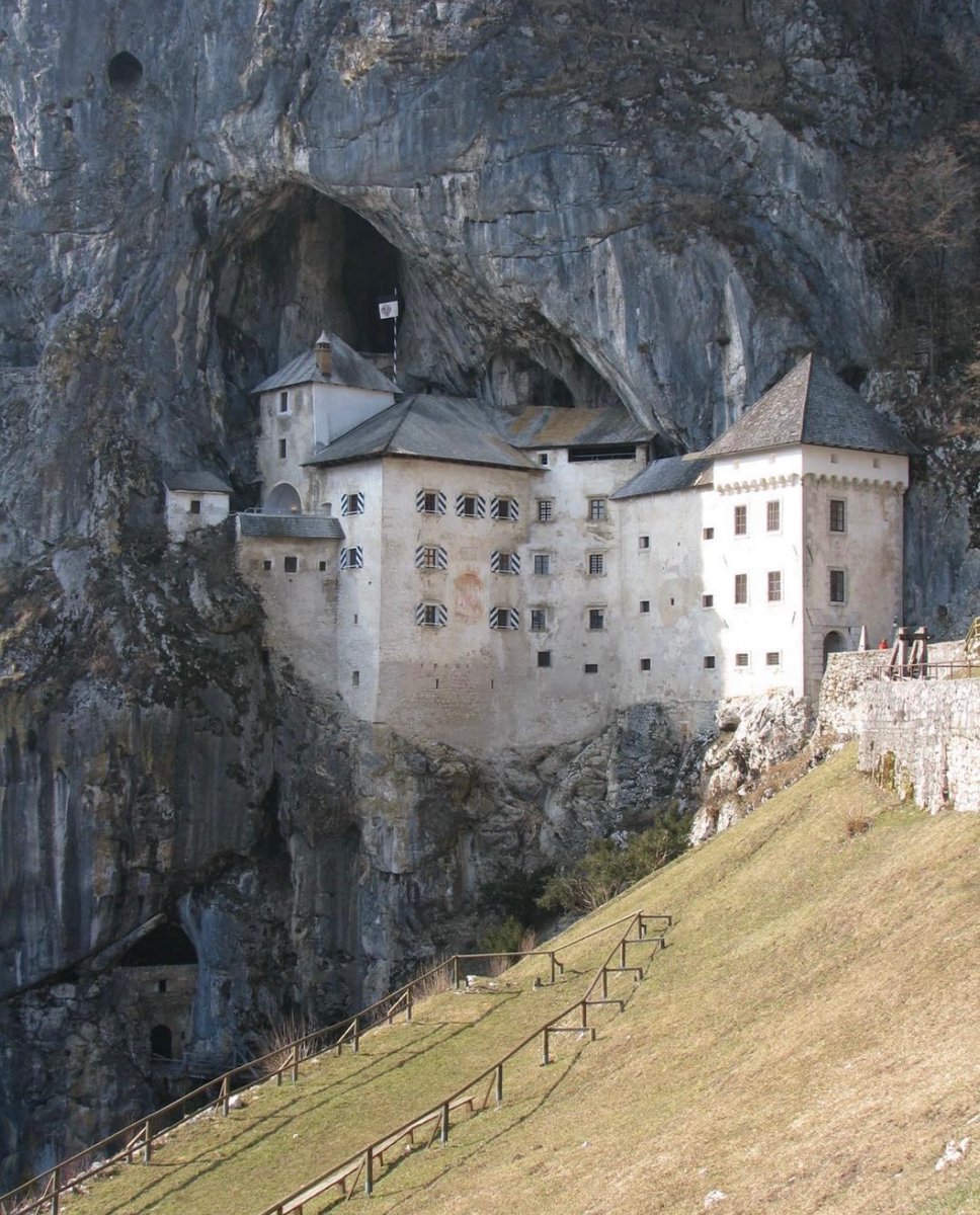 The Predjama Castle in Slovenia has been perched in the middle of a 123m high cliff for more than 800 years. It's the largest cave castle in the world, with a network of secret tunnels behind it that allowed the robber baron Erasmus to continue with his robberies.