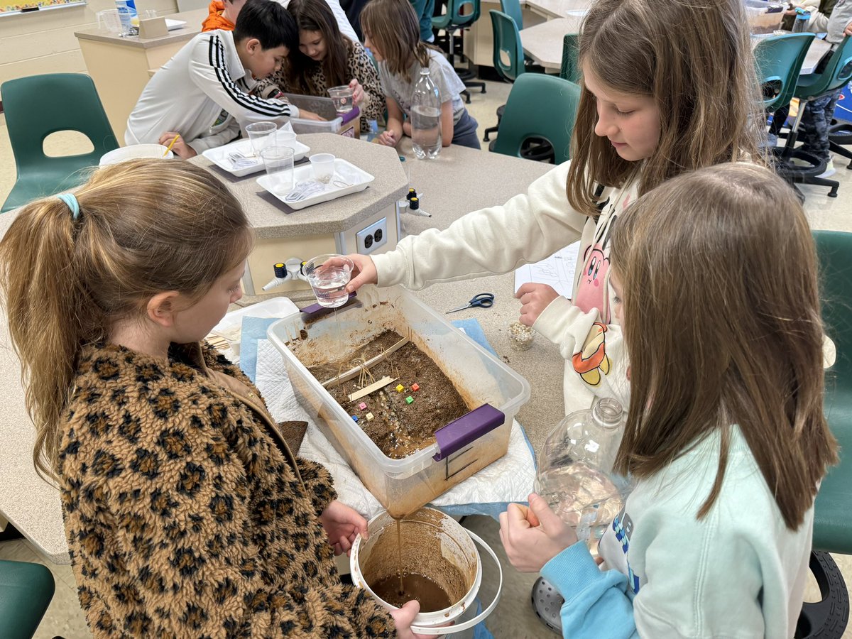 In the science lab building and testing our dams!