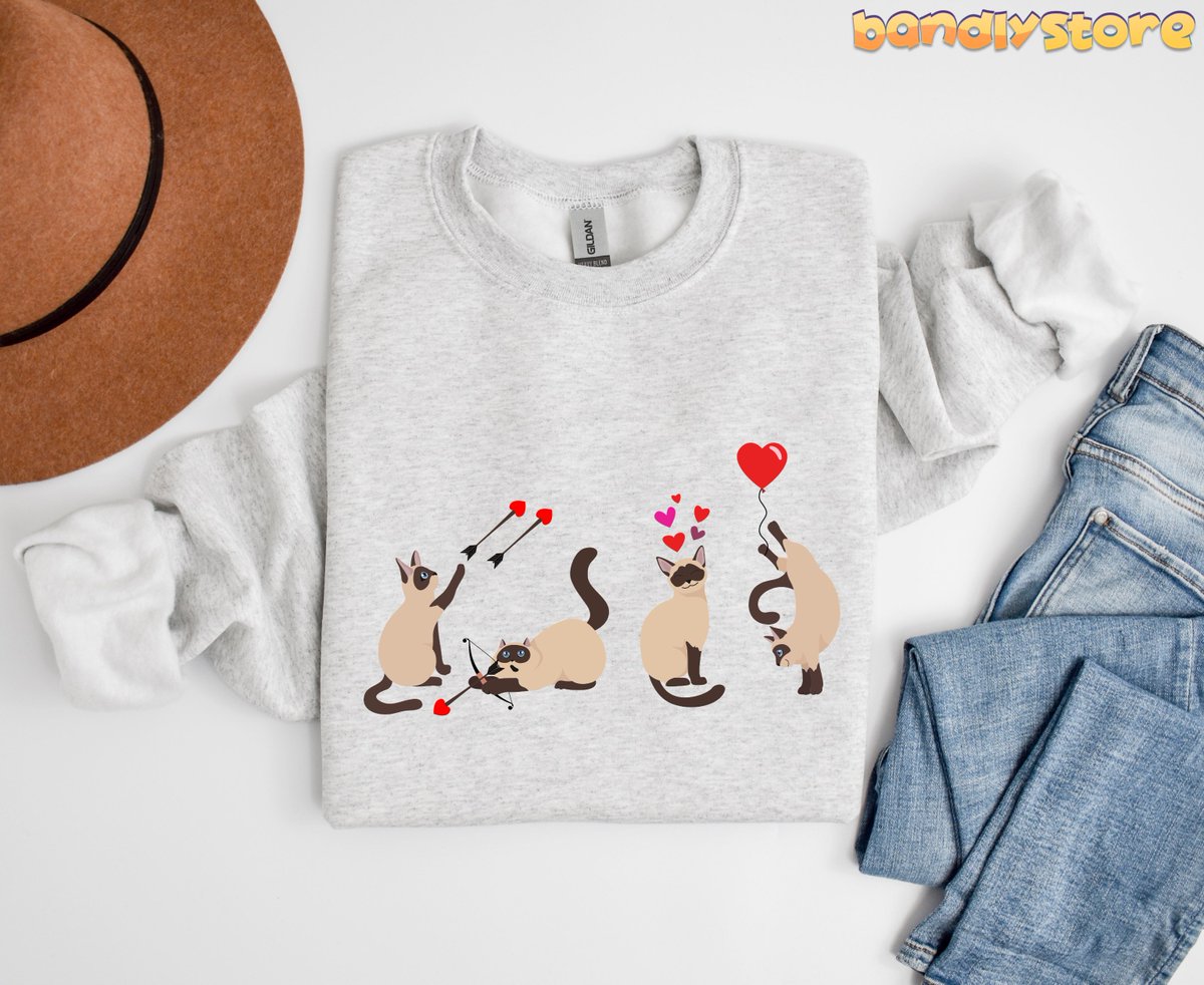 bandlystore's tweet photo. Celebrate Valentine's Day in style with our adorable Siamese Cat Sweatshirt!

https://t.co/eQ3mSI1pew

#SiameseCatGift #SiameseCatCrewneck #SiameseCatSweater #ValentinesDayShirt #CatMomSweatshirt #CatDadSweatshirt #ValentinesDayGift #SiameseCatLover #SiameseSweatshirt https://t.co/CJV7mWgzED