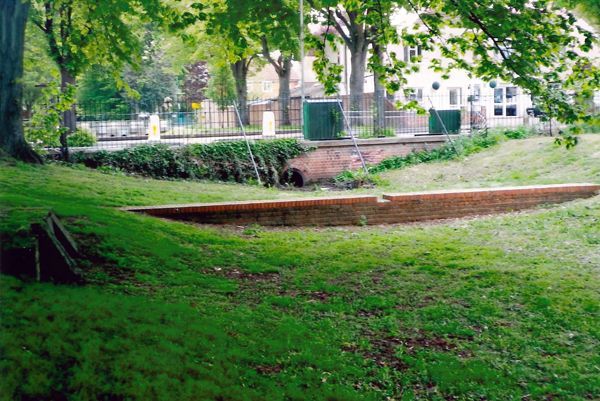 Wednesday Archive Day. This photograph taken in 2011 shows the course of River Wandle near Ruskin Road, Carshalton. The water flows from the Grotto in Carshalton Park and travels down to the High Street. At one time it split carrying water to the ponds and to the Westcroft Canal.