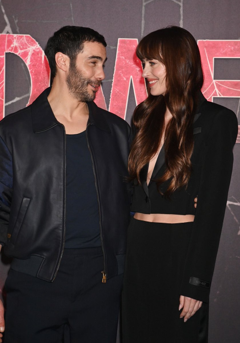 badpostsdakota's tweet photo. Dakota Johnson with Tahar Rahim and S. J. Clarkson at the "Madame Web" photocall in London, England. https://t.co/mjSiqOf4h0