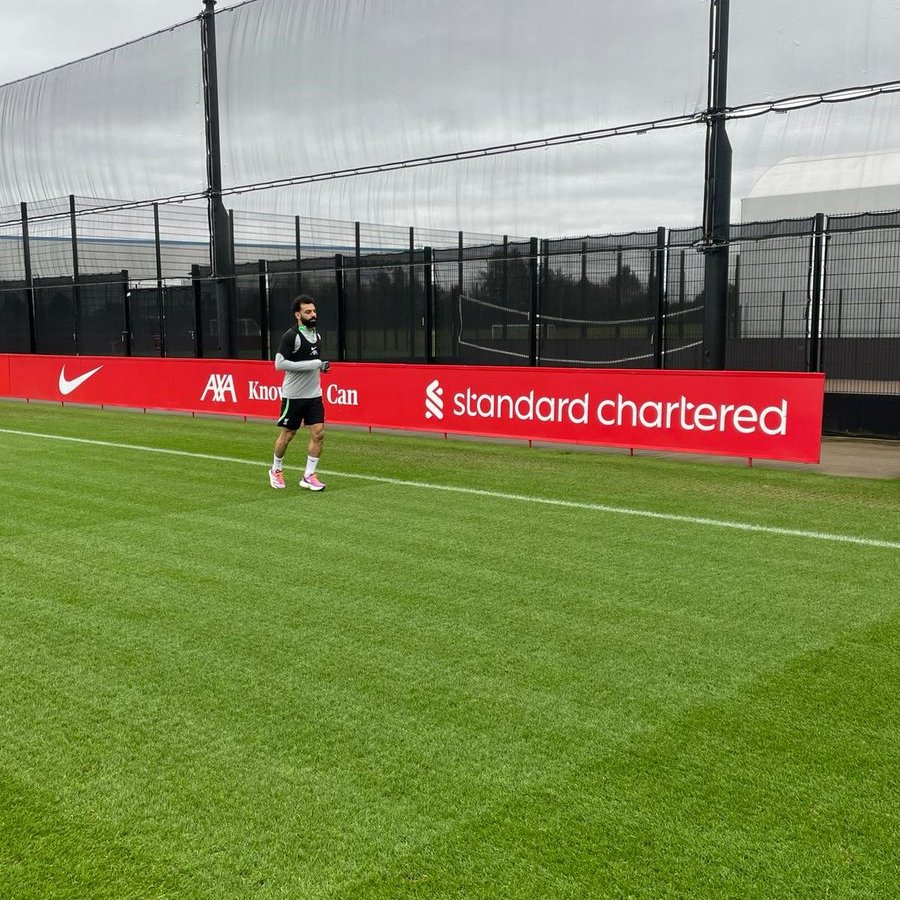 A photo of Mo Salah on the grass at the AXA Training Centre.