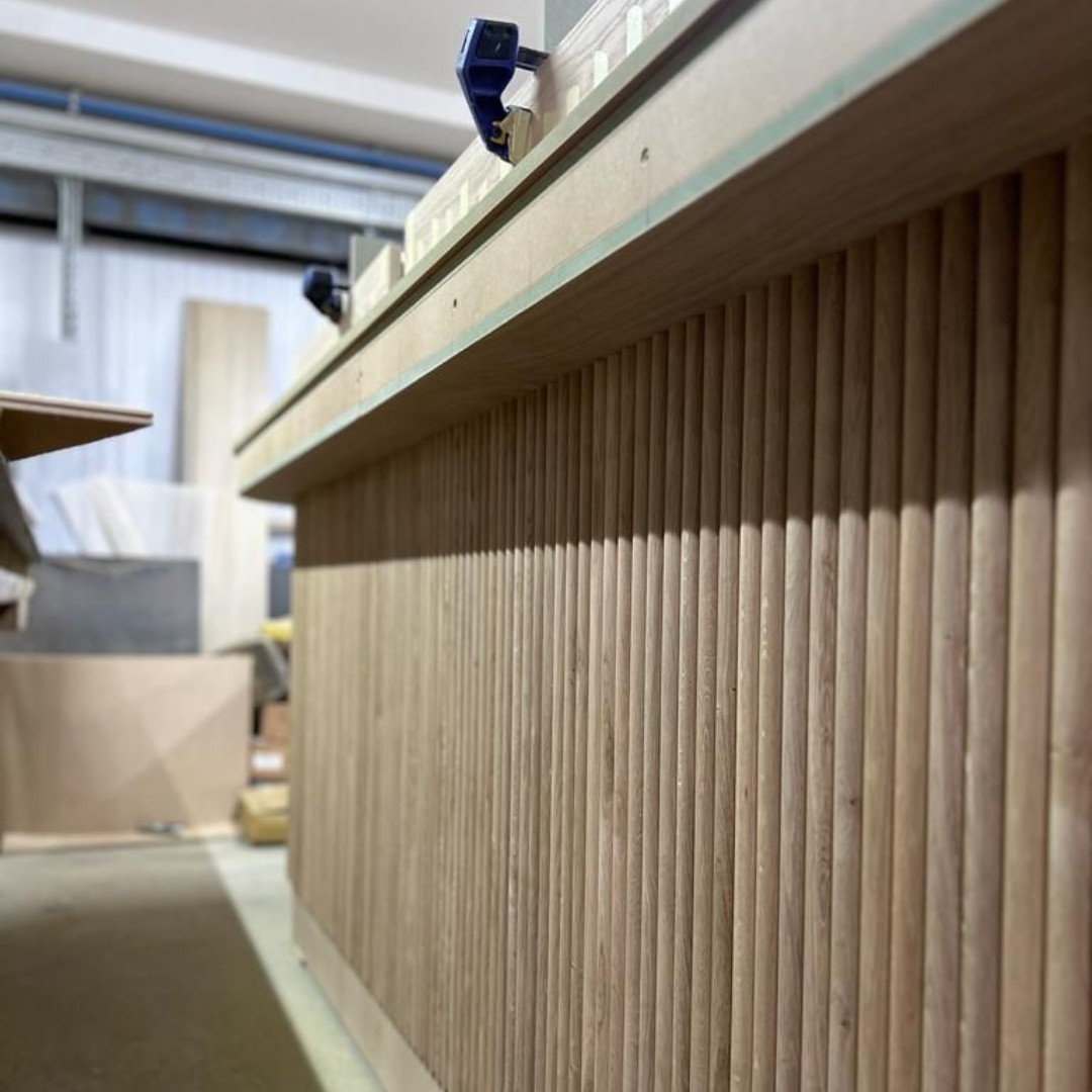 Cre8Joinery's tweet photo. We completed the front face of the bespoke bar in convex oak panelling, with laminate inner panels. The marble worktop will have a bespoke antique brass glass rack attached to it. We are excited to share the finished results. 🤩 #BespokeDesign #BarInstallation #OakPanelling https://t.co/onaktlPP68