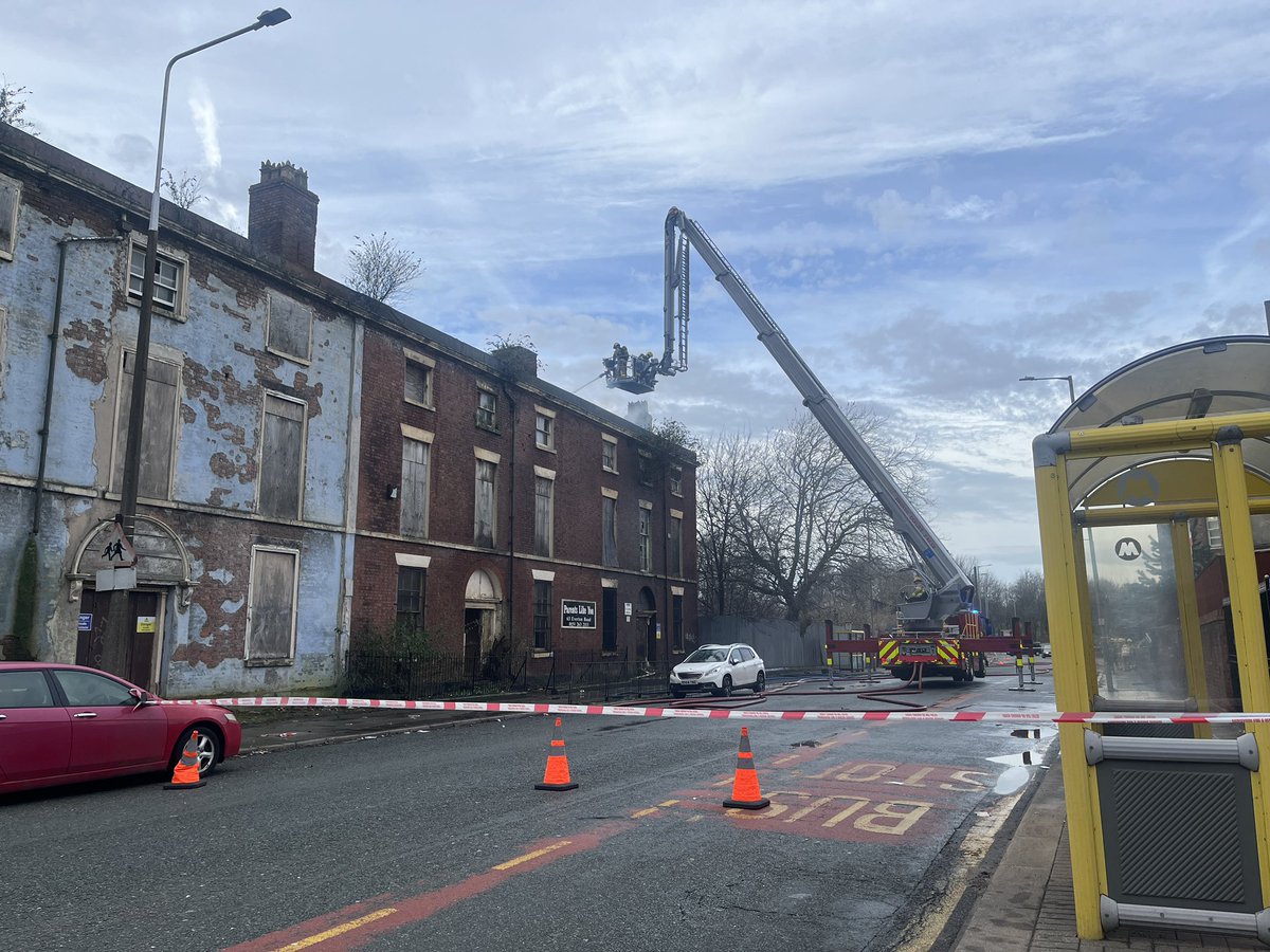 There’s one fire engine and an aerial platform currently at the scene. Two firefighters are on the platform battling the blaze, which appears to be in the roof