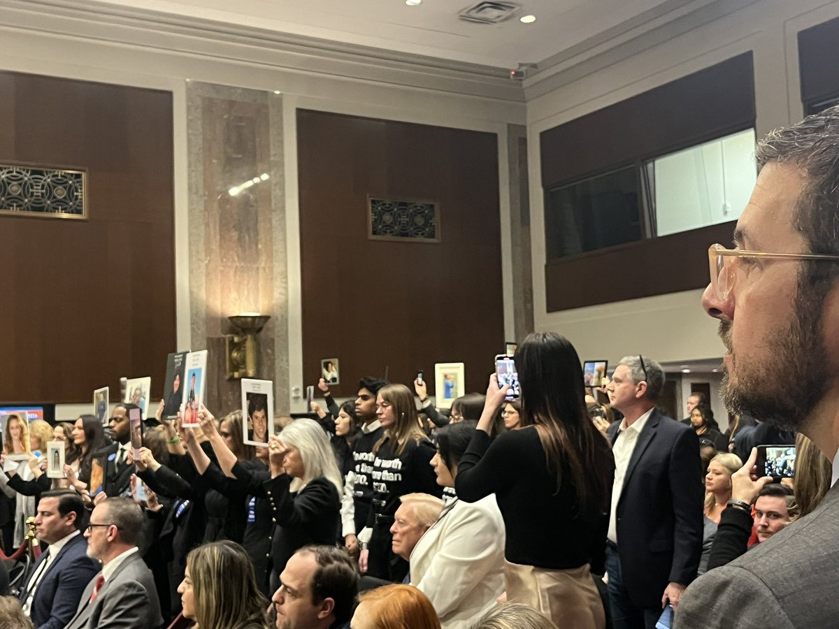 cagoldberglaw's tweet photo. Total silence and a sea of parents holding photos of their beautiful dead kids. As the hearing is about to begin https://t.co/FzPqlovVPY