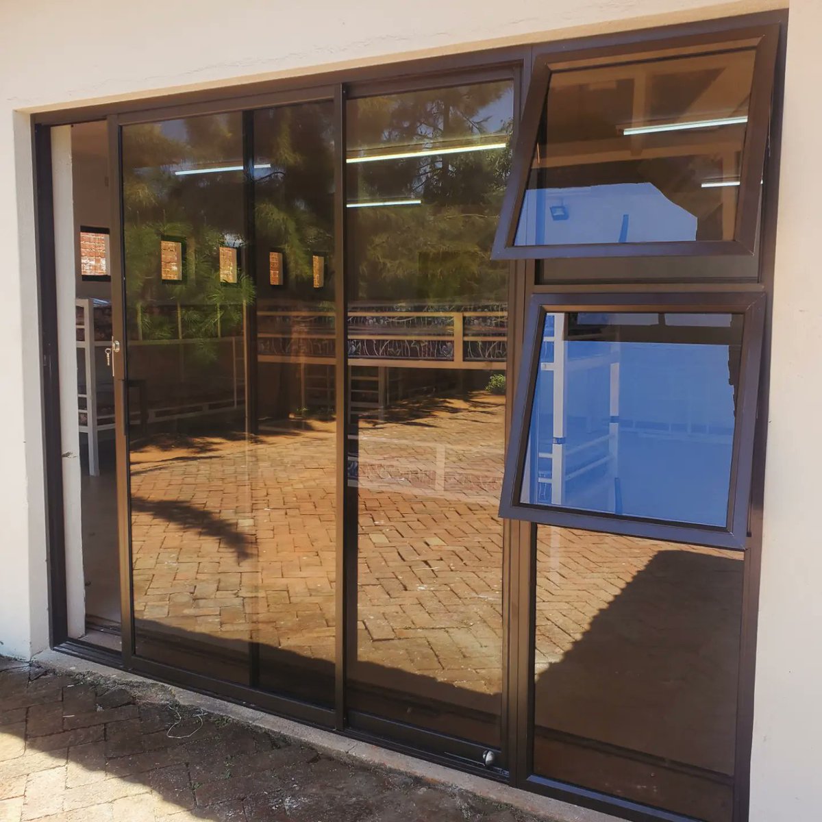 margchash's tweet photo. 700 series patio sliding doors with sidelights, glazed with bronze tinted glass.

We are a call away for all you ALUMINIUM &amp; GLASS requirements, we fabricate and deliver everything custom made to your preferred designs and colors.

@margchash
#Aluminiumandglass 
+263 783 574 677 https://t.co/hXwRBMSmg6