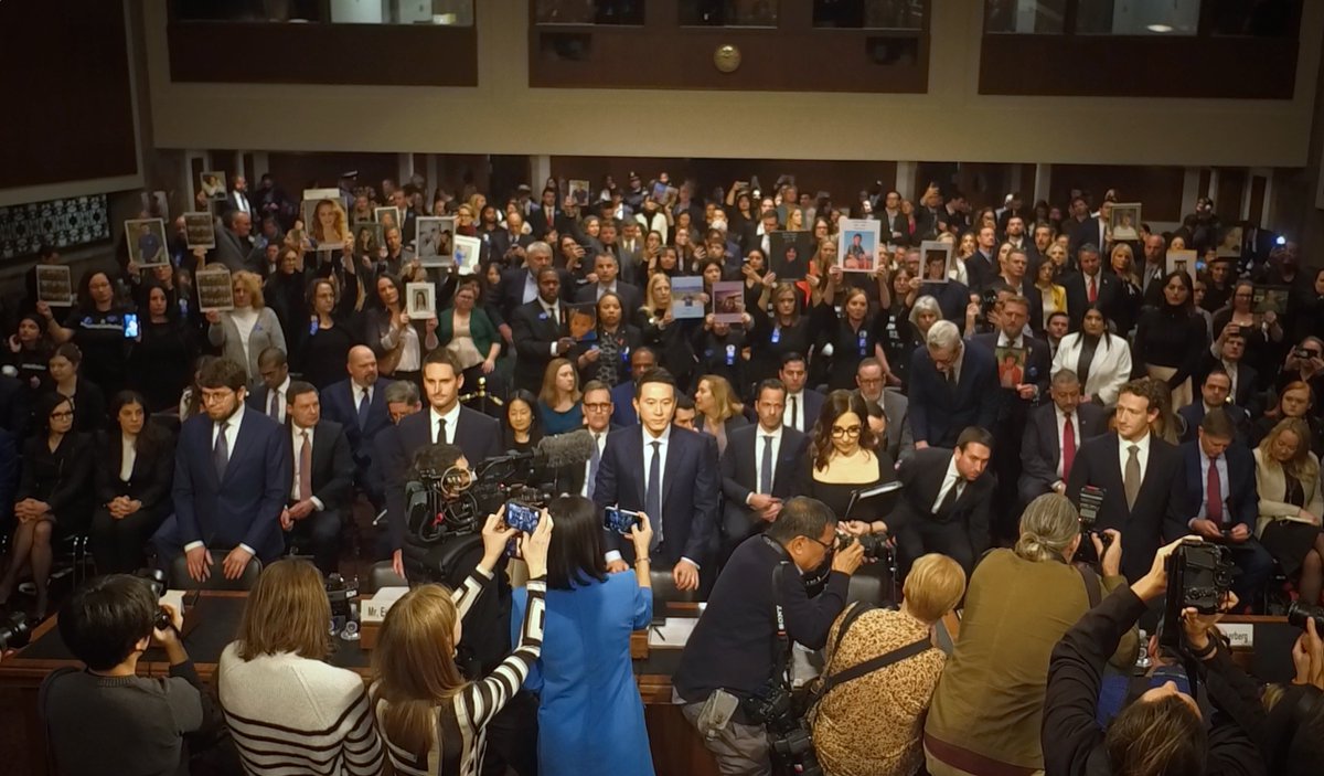 Powerful scene as the five CEOs of social media companies Discord, Snapchat, Tiktok, X and Meta arrived to testify before the Senate Judiciary Cmte. Family members held up pictures of children who have died or were harmed due to incidents linked to social media -->