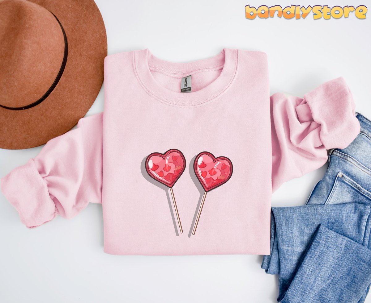 bandlystore's tweet photo. Our Cute Candy Hearts Sweatshirt is the perfect addition to your Valentine's Day wardrobe!

https://t.co/yjKCThvqRg

#CandyHeartShirt #CandyHeartSweater #HeartLollipopShirt #HeartSuckerShirt #CuteSweatshirt #GalentinesDayShirt #ValentinesDayGift #LoveSweatshirt #BeMineSweatshirt https://t.co/qVARJomeaP