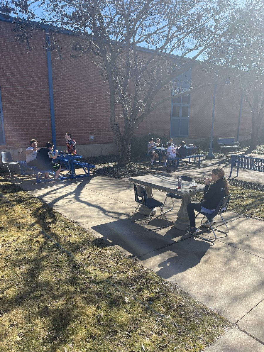 Students enjoying lunch outside with the warmer weather.