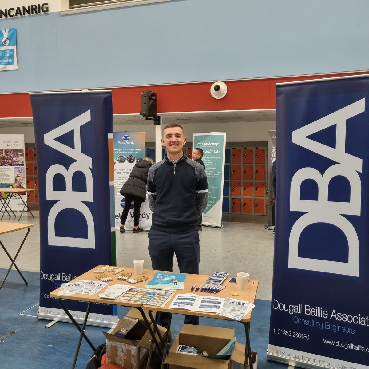 Young David McCarry set up and looking good on the DBA stand at the Duncanrig High School Careers fair