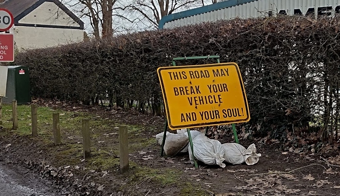 WRENBURY: Residents create own road sign warning drivers how 'worst road' in @CheshireEast will 'break their soul' - plenty of competition for 'worst road' label - full story thenantwichnews.co.uk/2024/01/31/vil…