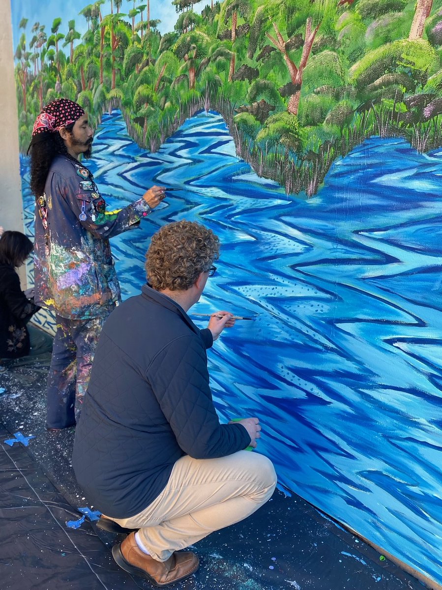 UNO_SoE's tweet photo. Thanks  to everyone who joined us for the mural painting celebration today on  campus. We were grateful to Raiz de la Ceiba, the muralist collective  who are creating our wonderful masterpiece. Some of us even got to help  paint! #nolaed #laed #unoproud https://t.co/p1yYiQvMoa