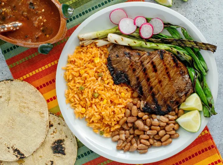 A Mexican dish like a carne asada for example, is very nutritious. A big prices of beef, onions, rice, beans (which are also extremely nutritious), and corn tortillas, that contain more protein and also carry less calories than a slice of white bread.