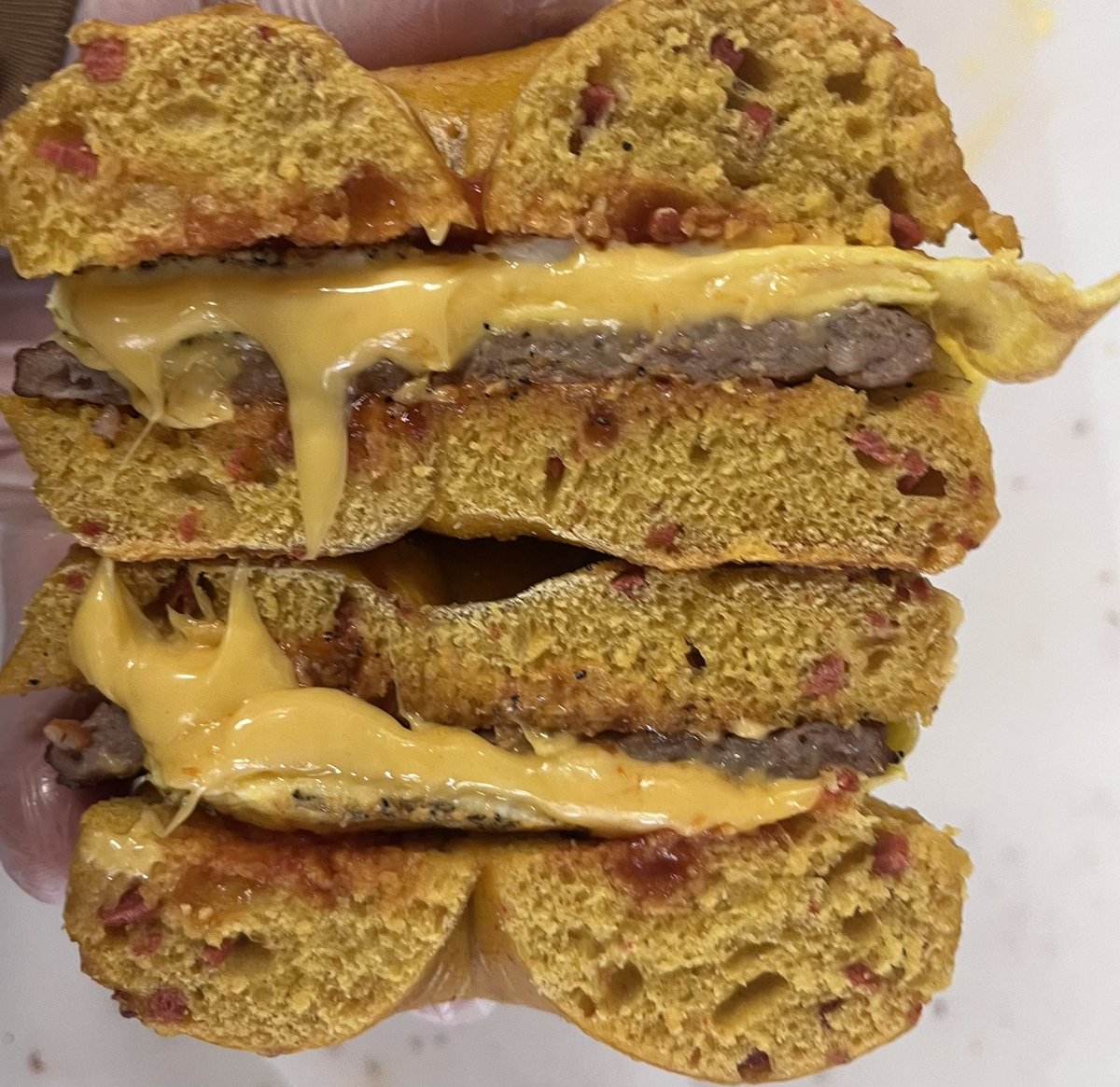 Eggstatic for this eggcellent sandwich! Sausage, Eggs &amp; Cheese on an Egg-Bacon Bagel!