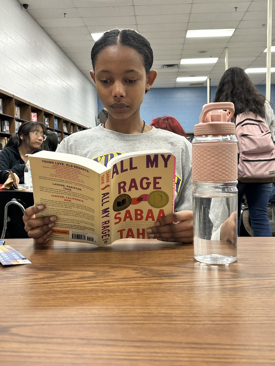 Lunchtime in the library! A student is deeply engaged in @sabaatahir’s All My Rage, one of the Adlit Book Club books donated to us by @readtosucceed! It’s a phenomenal read! It’s also an @VSBA_TN nominee! #onlyoneSHS @smyrnabulldog