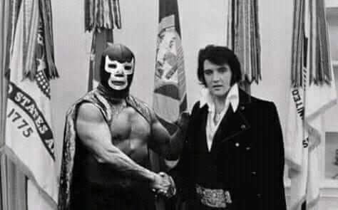 Legendary luchador Blue Demon and Elvis Presley in a promo photo from 1974, where they announced a partnership to produce a line of blue suede wrestling boots.