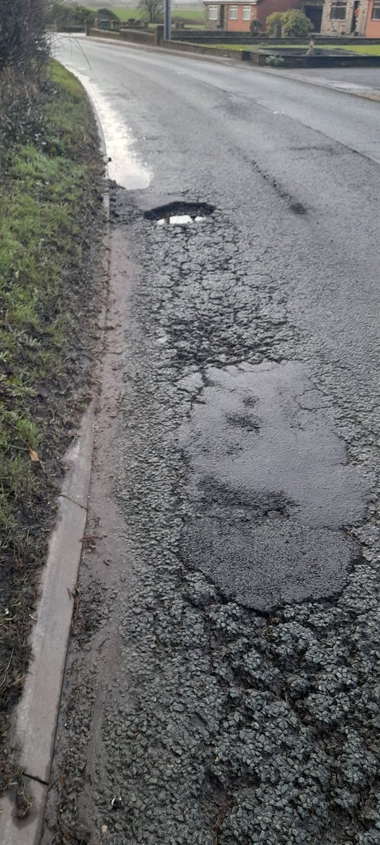 robertturnock's tweet photo. I hit a pothole today, burst my tyre and nearly crashed my car. This is the B5426 between Rufford and Bispham. There are so many potholes that the road is unsafe. When are @LancashireCC going to resurface the road properly rather than doing terrible repairs that don't last? https://t.co/tnxWBkVbge