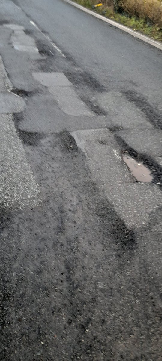 robertturnock's tweet photo. I hit a pothole today, burst my tyre and nearly crashed my car. This is the B5426 between Rufford and Bispham. There are so many potholes that the road is unsafe. When are @LancashireCC going to resurface the road properly rather than doing terrible repairs that don't last? https://t.co/tnxWBkVbge