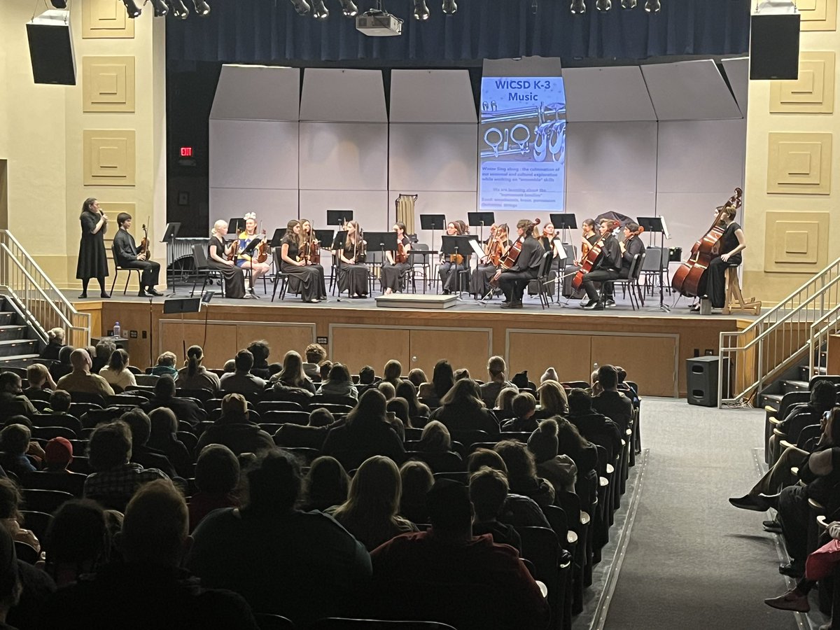 Third grade aspiring musicians watching the IHS Philharmonic Orchestra. Our student audience members are getting excited to join the esteemed music education offerings available in 4th grade! <a href="/WestIrondequoit/">West Irondequoit CSD</a>