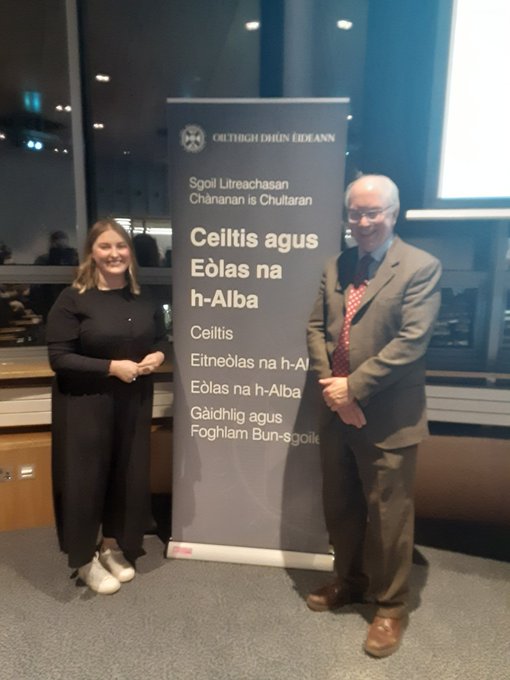 Katie NicAonghais agus an t-Àrd Oll. Rob Dubar an dèidh na h-òraide a thug Katie seachad, a' cur fèill chuimhneachaidh Iain Mhic Leòid air dòigh. 

Le taing do ar caraidean, <a href="/NationalMod/">Mòd Nàiseanta Rìoghail ¦ Royal National Mòd</a>!